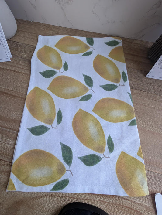 Towel with lemon pattern on a wooden surface